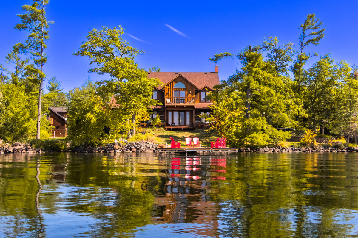 A finished waterfront space at golden hour, looking across the water