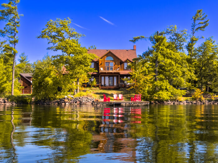 A finished waterfront space at golden hour, looking across the water